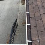 Corner of an eavestrough clean of debris