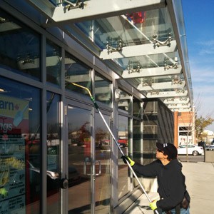 Exterior window cleaning of retail stores in Toronto.