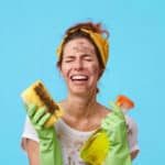 A woman distressed over having to clean her windows.